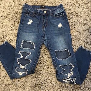 Blue jeans with fake rips